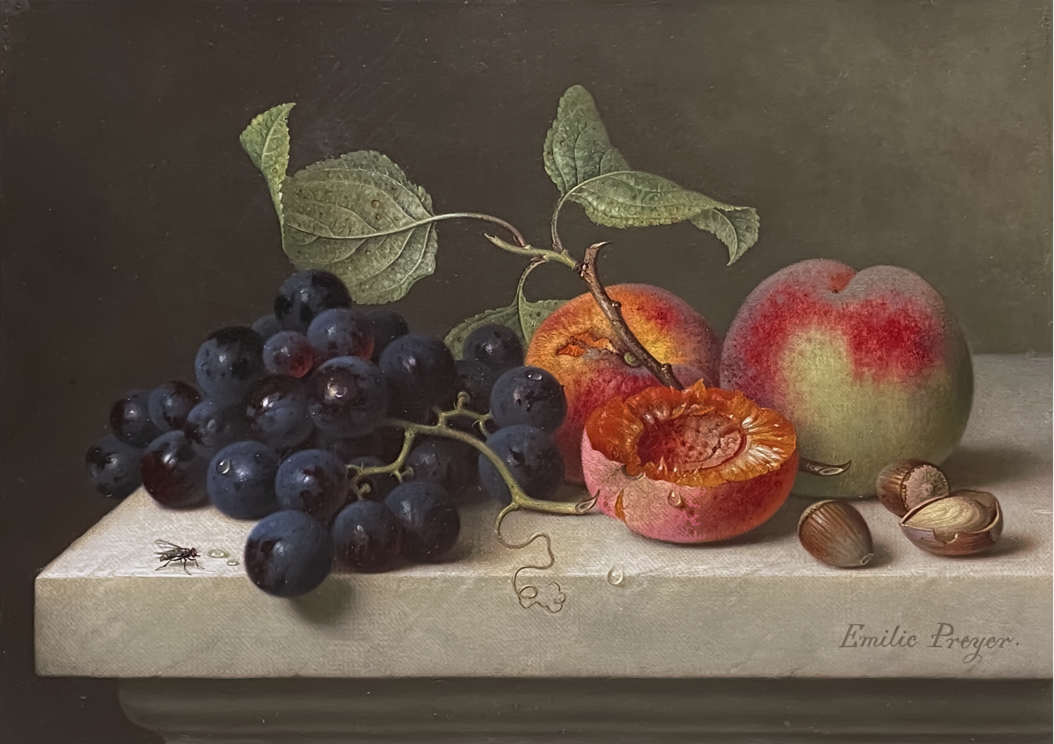 Still life with grapes, peaches and hazelnuts on a marble platter